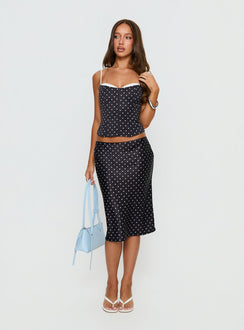   side view of model wearing Princess Polly Somani Satin Midi Skirt Black Polka Dot Midi Skirts 