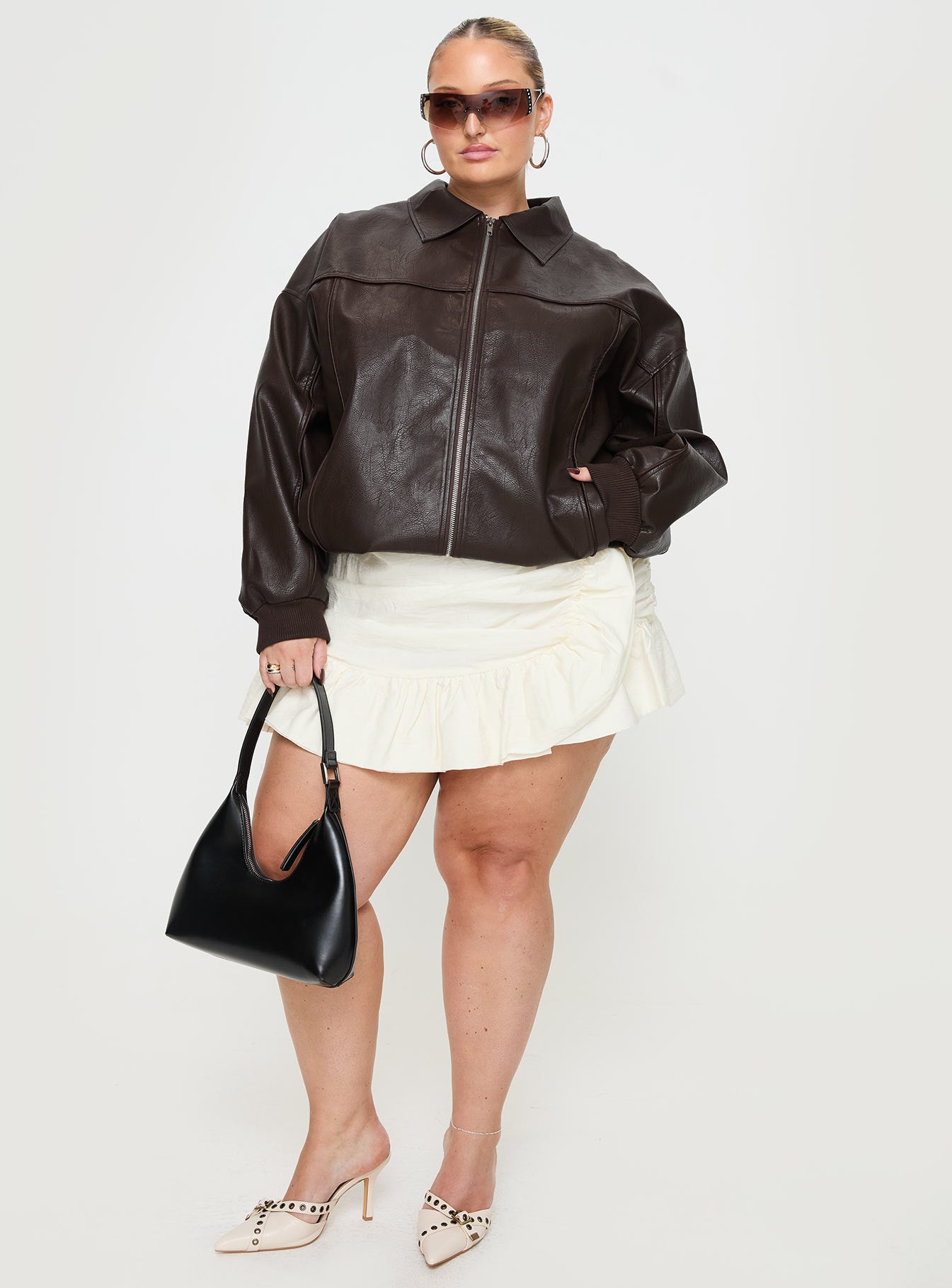 Brown Bomber jacket Oversized fit, faux leather material, classic collar, zip front fastening, ribbed waistband and cuffs, twin hip pockets