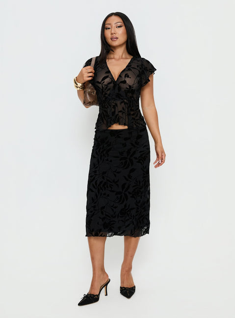 back view of model wearing Princess Polly Atira Midi Skirt Leaf Flower Black Midi Skirts 