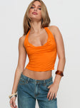 front view of model wearing Princess Polly Irina Multi-wear Top Orange Sleeveless Asymmetric Neckline 