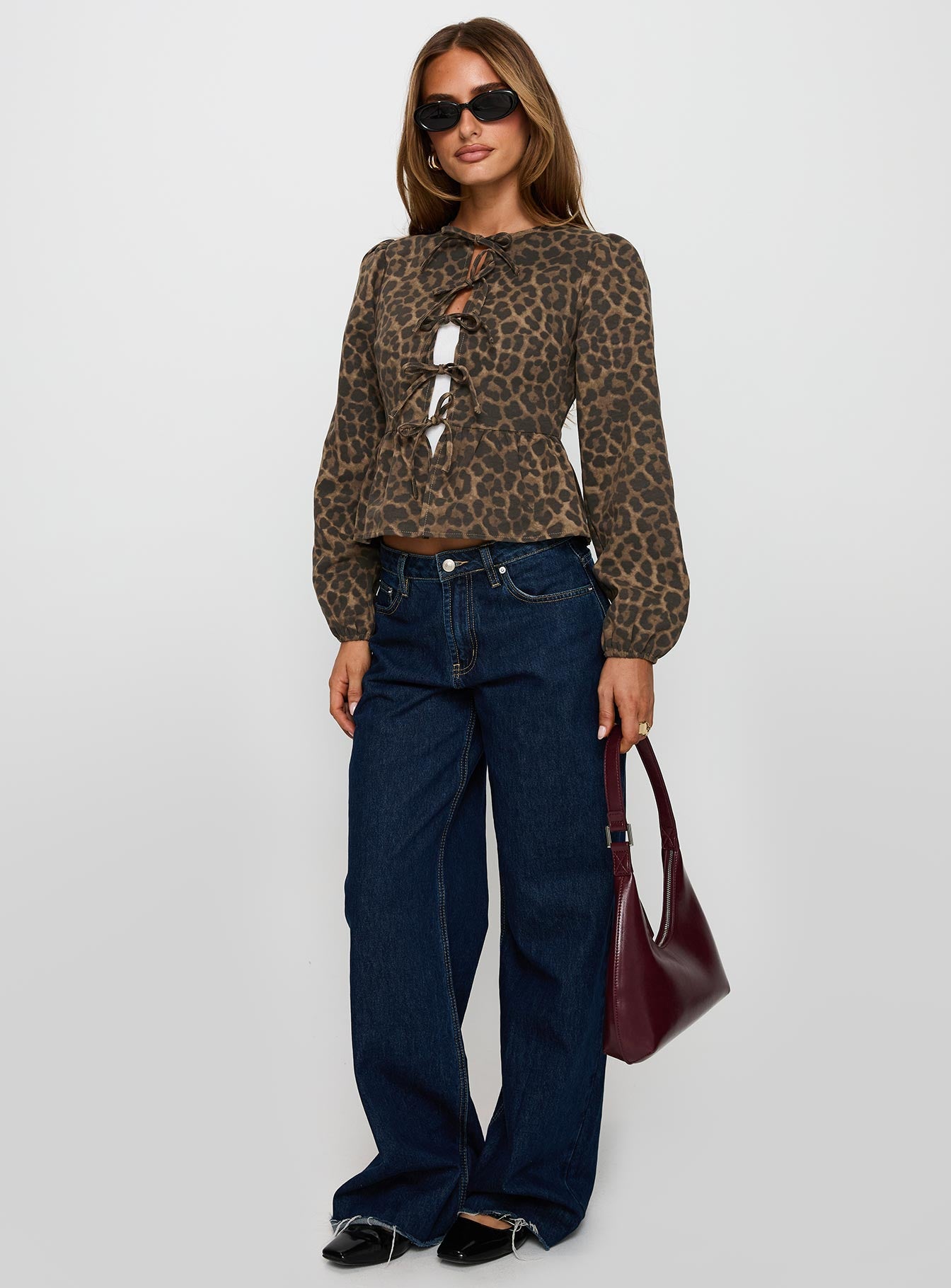 front view of model wearing Princess Polly Recognize Tie Detail Long Sleeve Top Leopard Full Sleeves Crew Neck 