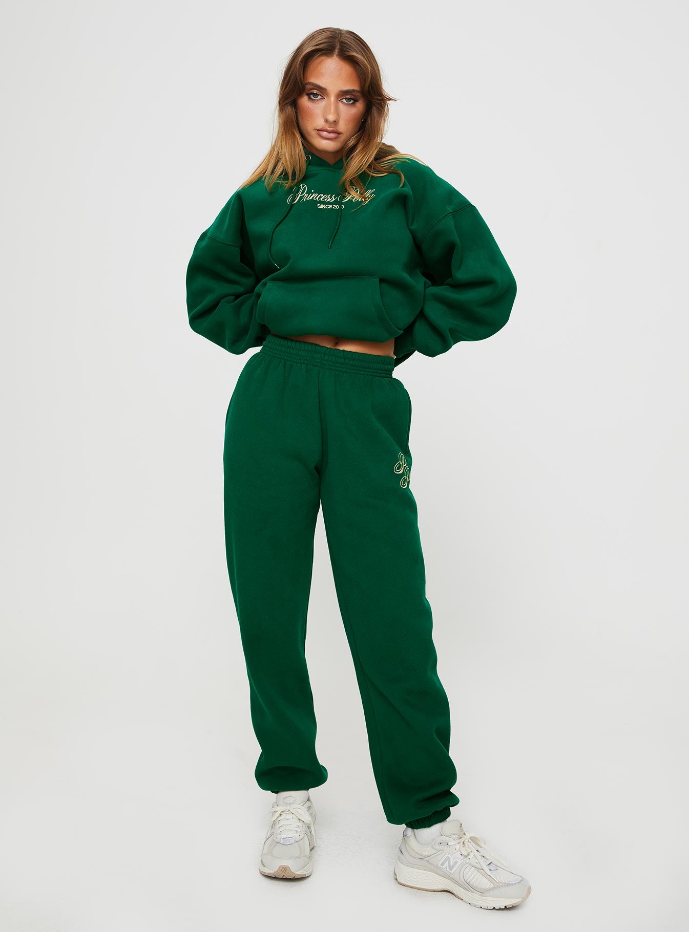 front view of model wearing Princess Polly Princess Polly Track Pants Script Green / Ivory High Waisted Pants 
