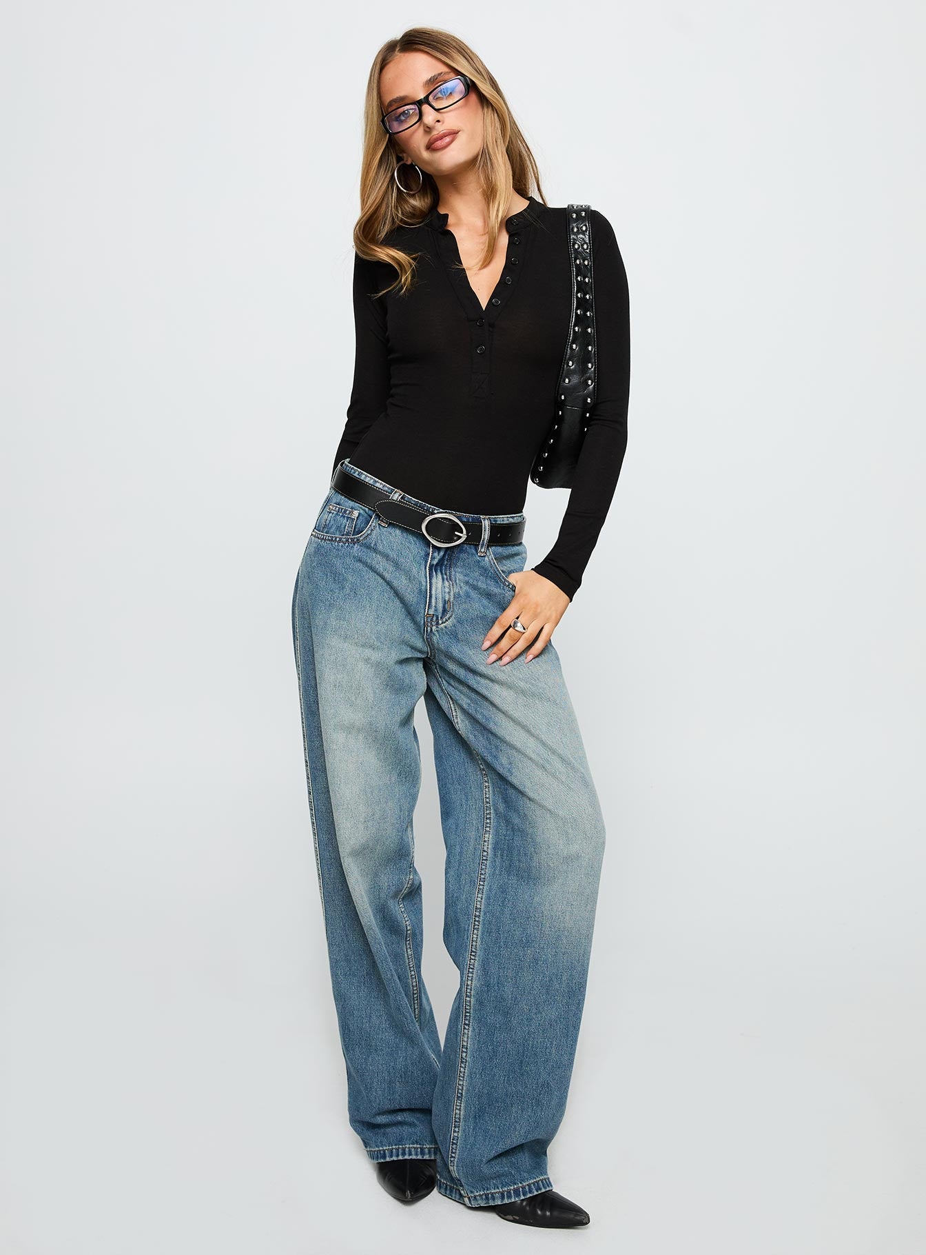 side view of model wearing Princess Polly Kandis Long Sleeve Bodysuit Black Long Sleeve Tops 