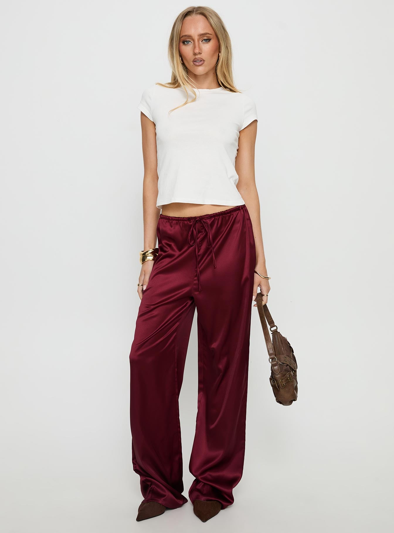 front view of model wearing Princess Polly Soulstar Satin Pants Wine Mid Rise Pants 