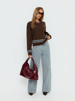 side view of model wearing Princess Polly Yarnia V Neck Jumper Brown / Blue regular 