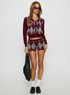 front view of model wearing Princess Polly Raiven Knit Cardigan Burgundy Argyle cropped 