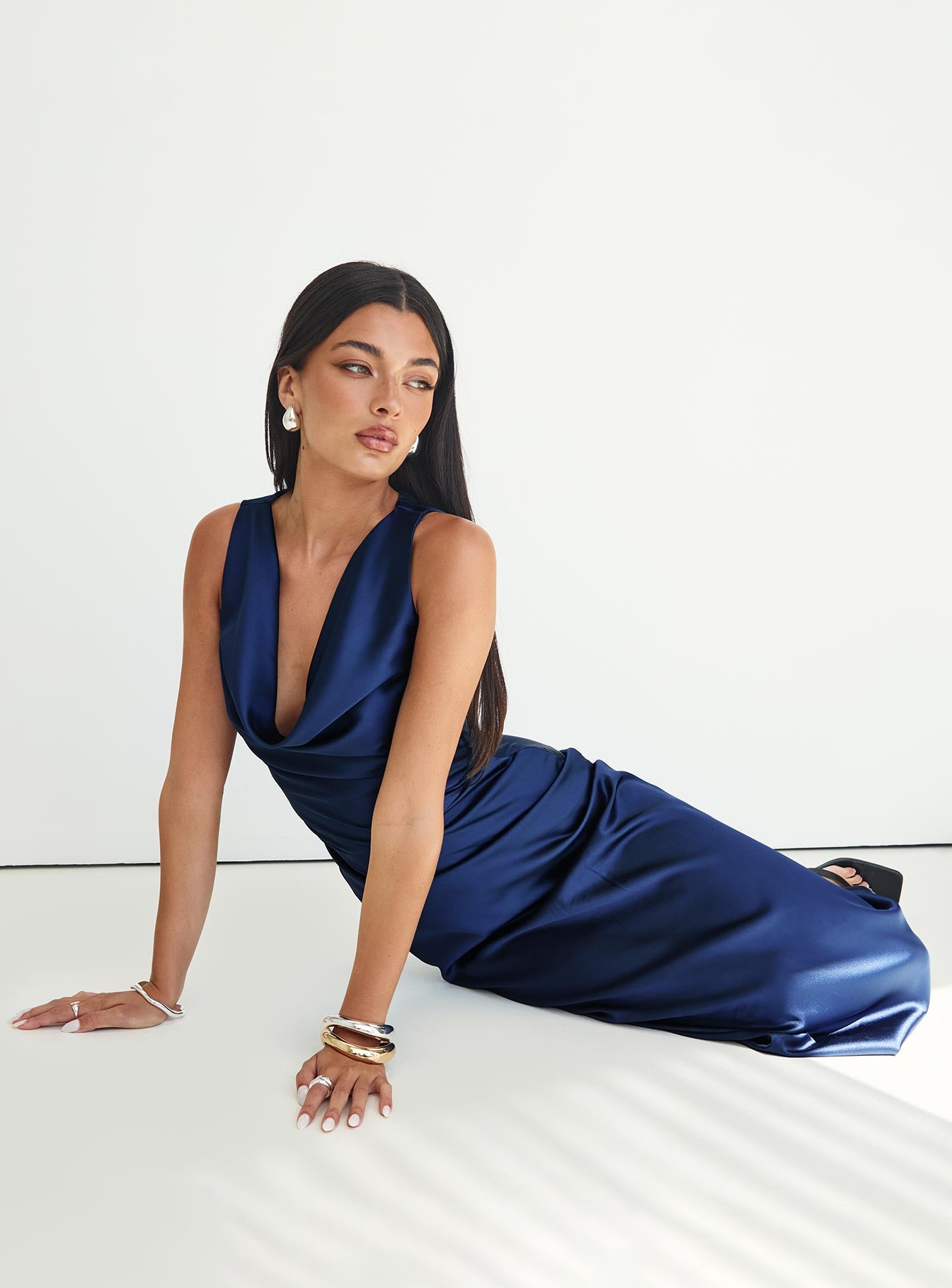 side view of model wearing Princess Polly Soprano Plunge Maxi Dress Navy Cowl Neck 