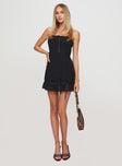 front view of model wearing Princess Polly Molloy Strapless Mini Dress Black Straight Neck 