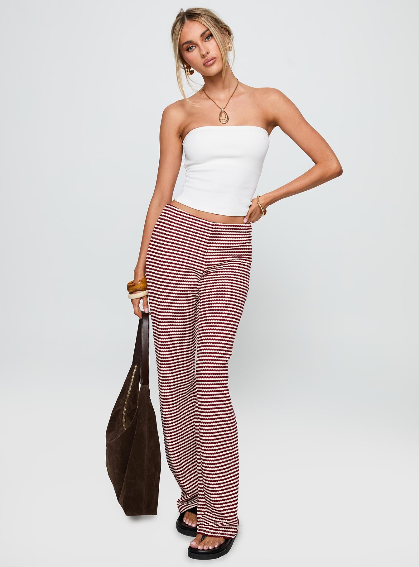 front view of model wearing Princess Polly Next To Me Lounge Pant Red / White Stripe Low Rise Pants 