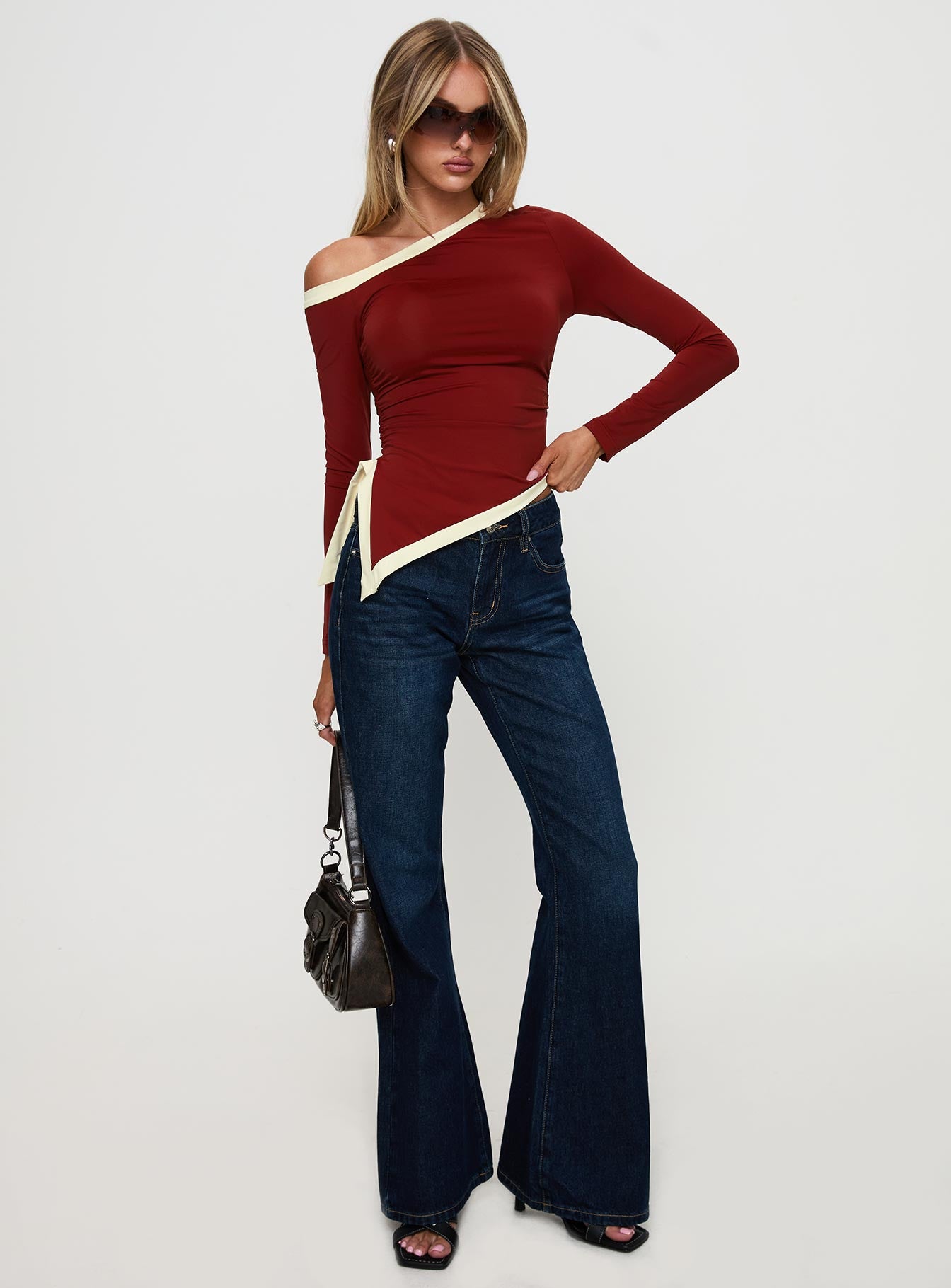 front view of model wearing Princess Polly Fake Smile Long Sleeve Top Burgundy / Cream Full Sleeves Asymmetric Neckline 