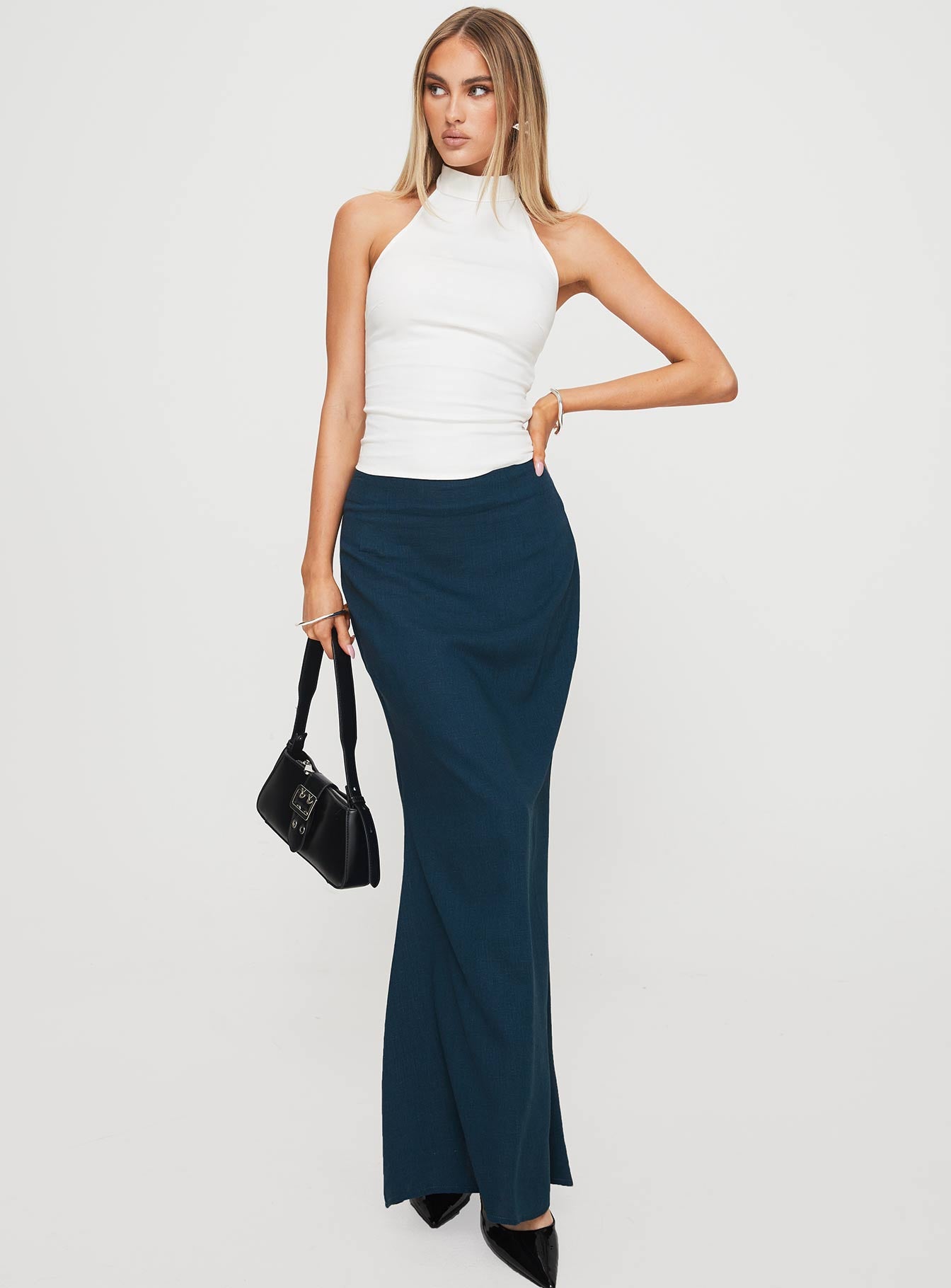   side view of model wearing Princess Polly Sophia Maxi Skirt Navy Maxi 