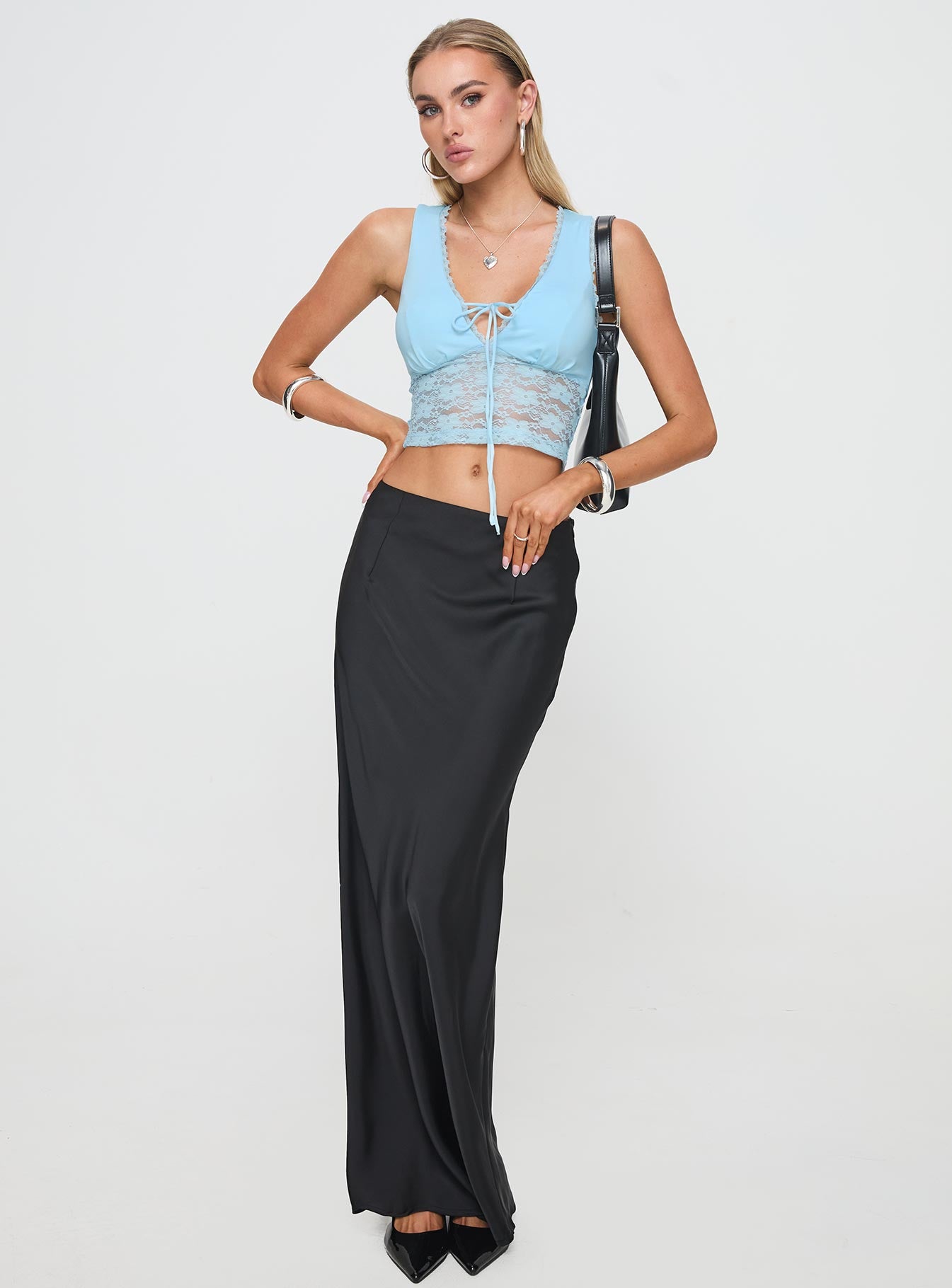 side view of model wearing Princess Polly Isolde Top Blue Sleeveless V-Neck 