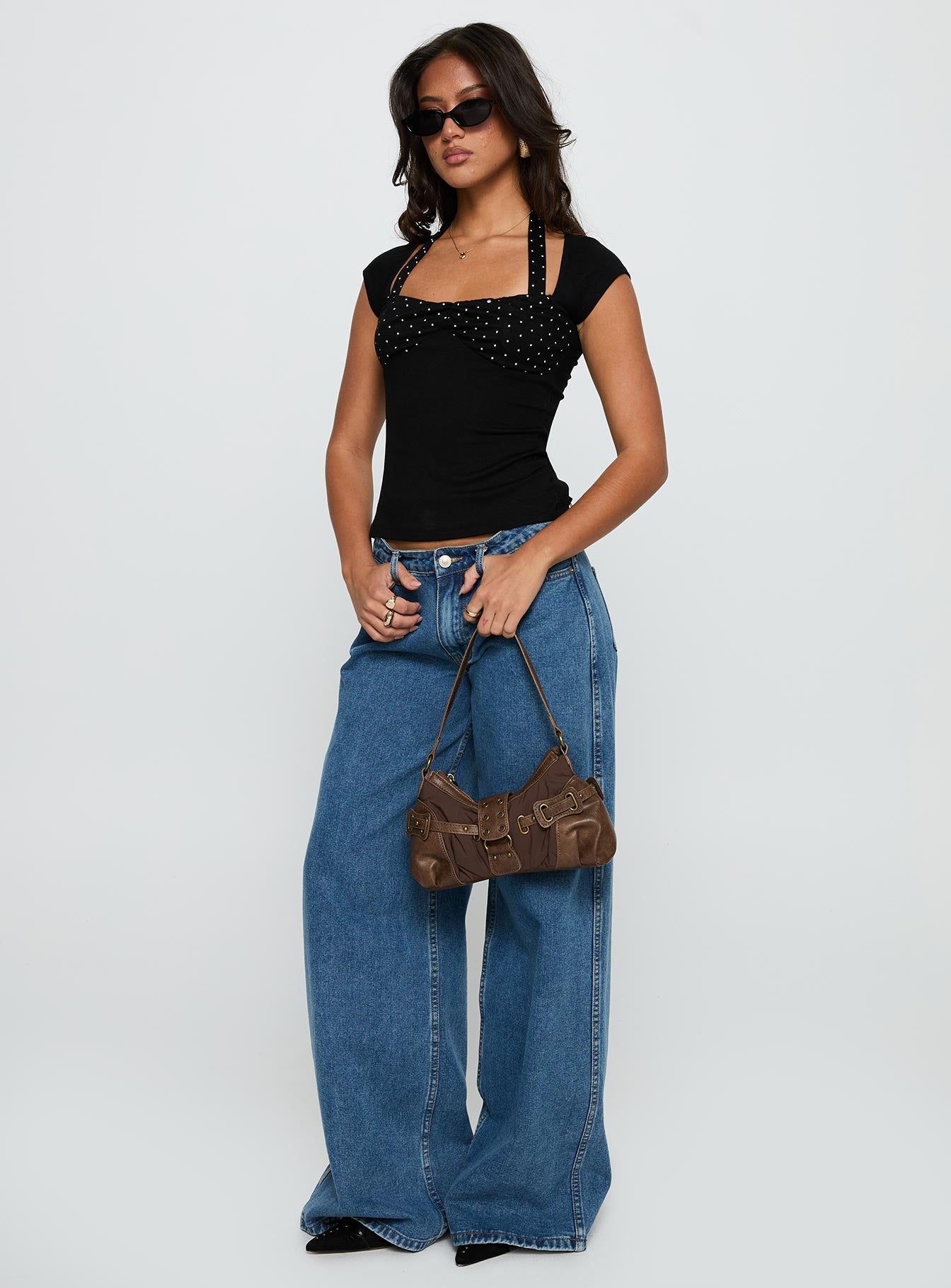 side view of model wearing Princess Polly Emberglow Top Black / Polka Short Sleeves Square Neck 