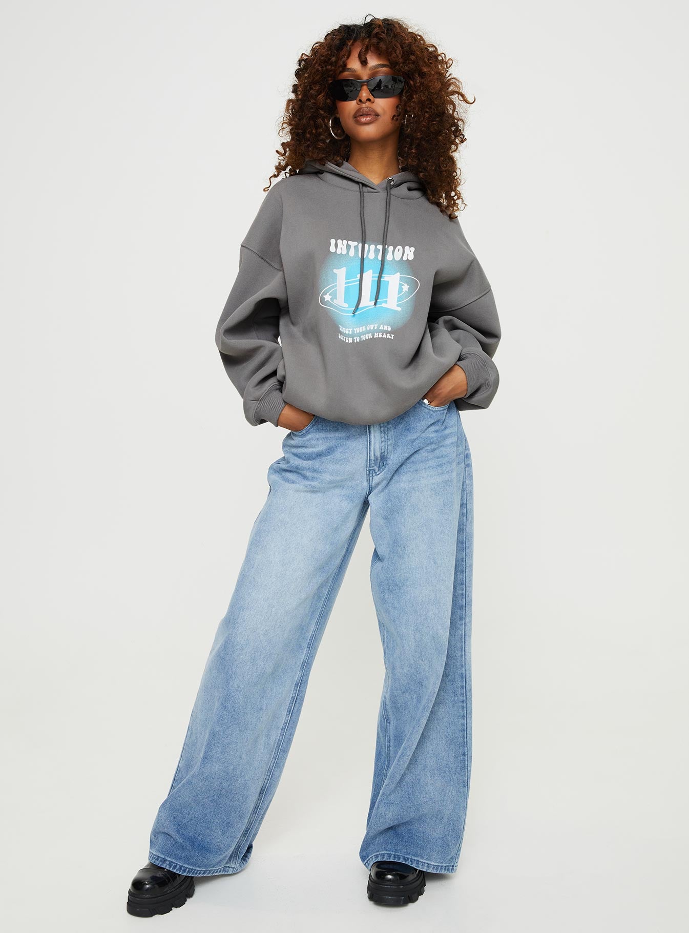 front view of model wearing Princess Polly Intuition Hooded Sweatshirt Bubble Text Charcoal regular 