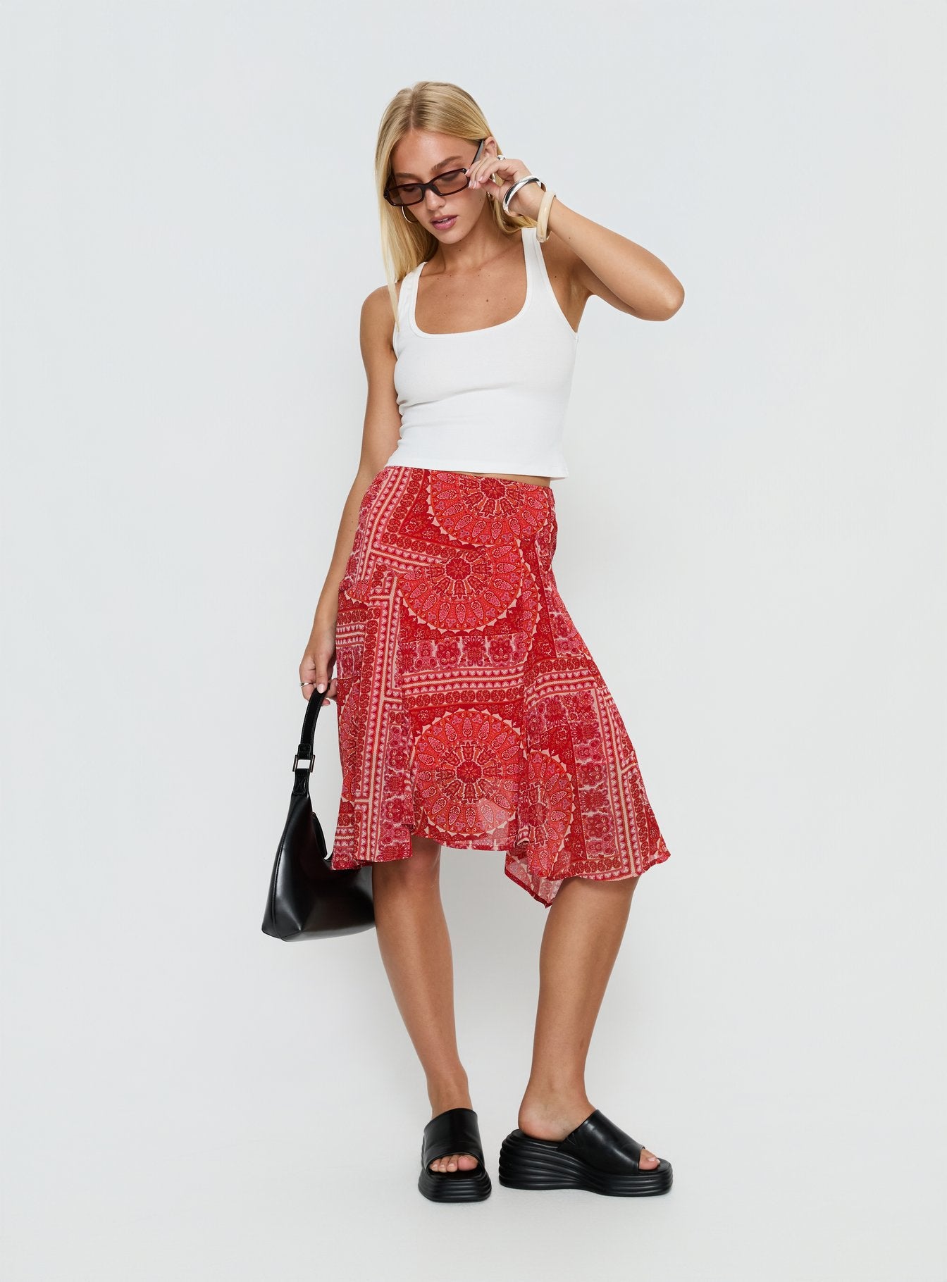   front view of model wearing Princess Polly Raenah Asymmetrical Midi Skirt Red Paisley 