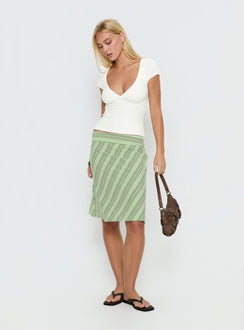   side view of model wearing Princess Polly Lemon Twist Midi Skirt Green Stripe Knee 