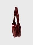 Red Faux leather shoulder bag Adjustable shoulder strap, gold toned hardware, zip fastening
