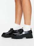 Faux patent leather loafers Rounded toe, lace up fastening, pull tab at back, treaded sole