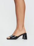 Heels Square toe, flared heel block, wide single upper strap, padded footbed, slip-on design