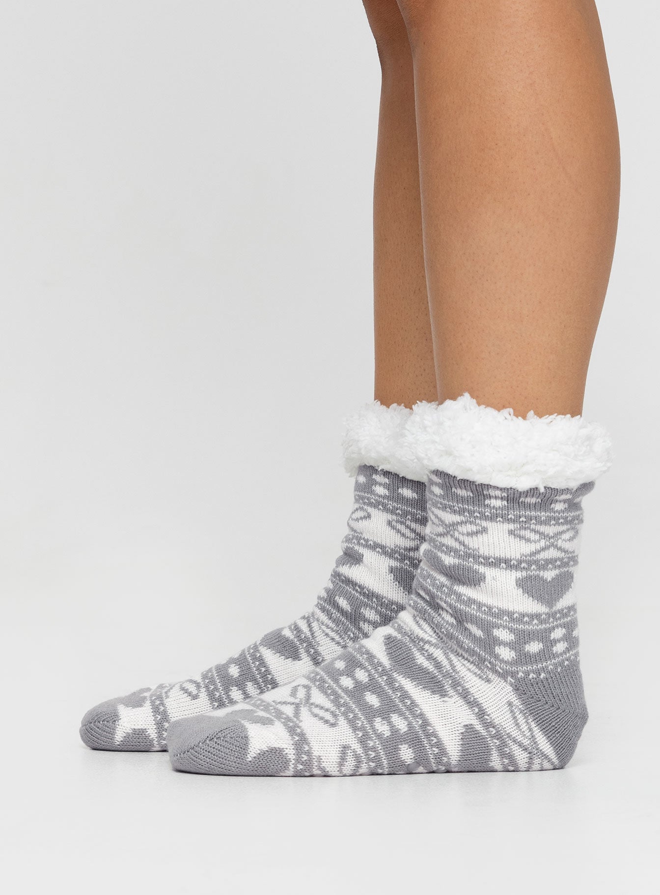 Winter socks, printed design Soft fleece lining, grip on bottoms Cold hand wash 