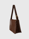 Faux leather bag  Adjustable shoulder strap, gold-toned buckle, single internal pocket with zip fastening, fully lined