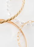 Gold-toned bracelet pack Four separate bracelets, chain and bangle style, pearl detail, lightweight 