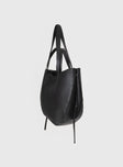 Bag  Shoulder bag style, faux leather Two different size fixed straps, clasp fastenings at sides of bag, three inner pockets one with zip fastening, tassel detail at sides Inner-center magnetic clasp fastening