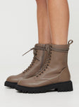 Faux leather boot Lace up fastening, rounded toe, pull tab at back, platform base, padded footbed