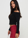 side view of model wearing Princess Polly Malian Long Sleeve Top Black Full Sleeves Asymmetric Neckline 