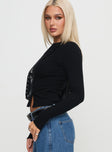 side view of model wearing Princess Polly Passoni Long Sleeve Top Black Full Sleeves Crew Neck 