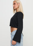 side view of model wearing Princess Polly Rhydian Long Sleeve Tie Top Black Full Sleeves Crew Neck 