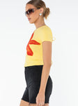 Graphic print tee Cap sleeve, adjustable cut-outs at back with tie fastening
