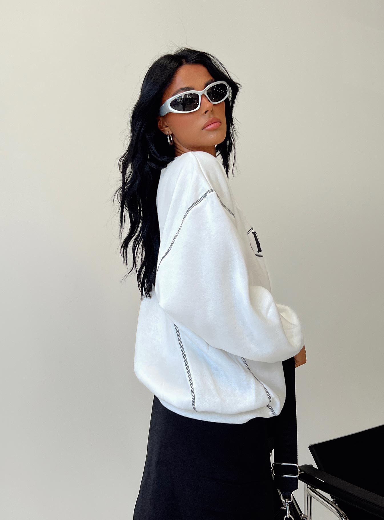 side view of model wearing Princess Polly Portland Oversized Crewneck Sweatshirt White 