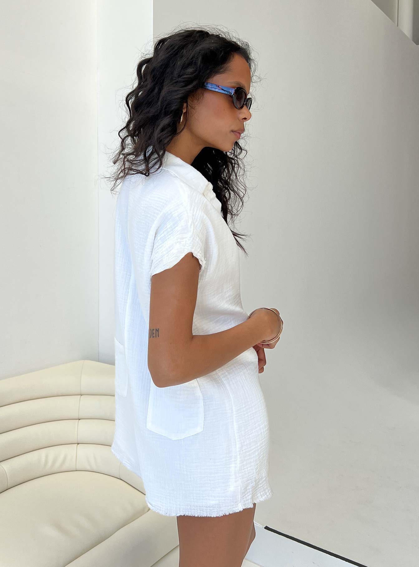 Romper Muslin material Classic collar V neckline Button fastening at front Raw edge hem