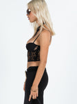 Crop top Sheer lace material Adjustable shoulder straps Sweetheart neckline Invisible zip fastening at side Slight stretch Lined bust