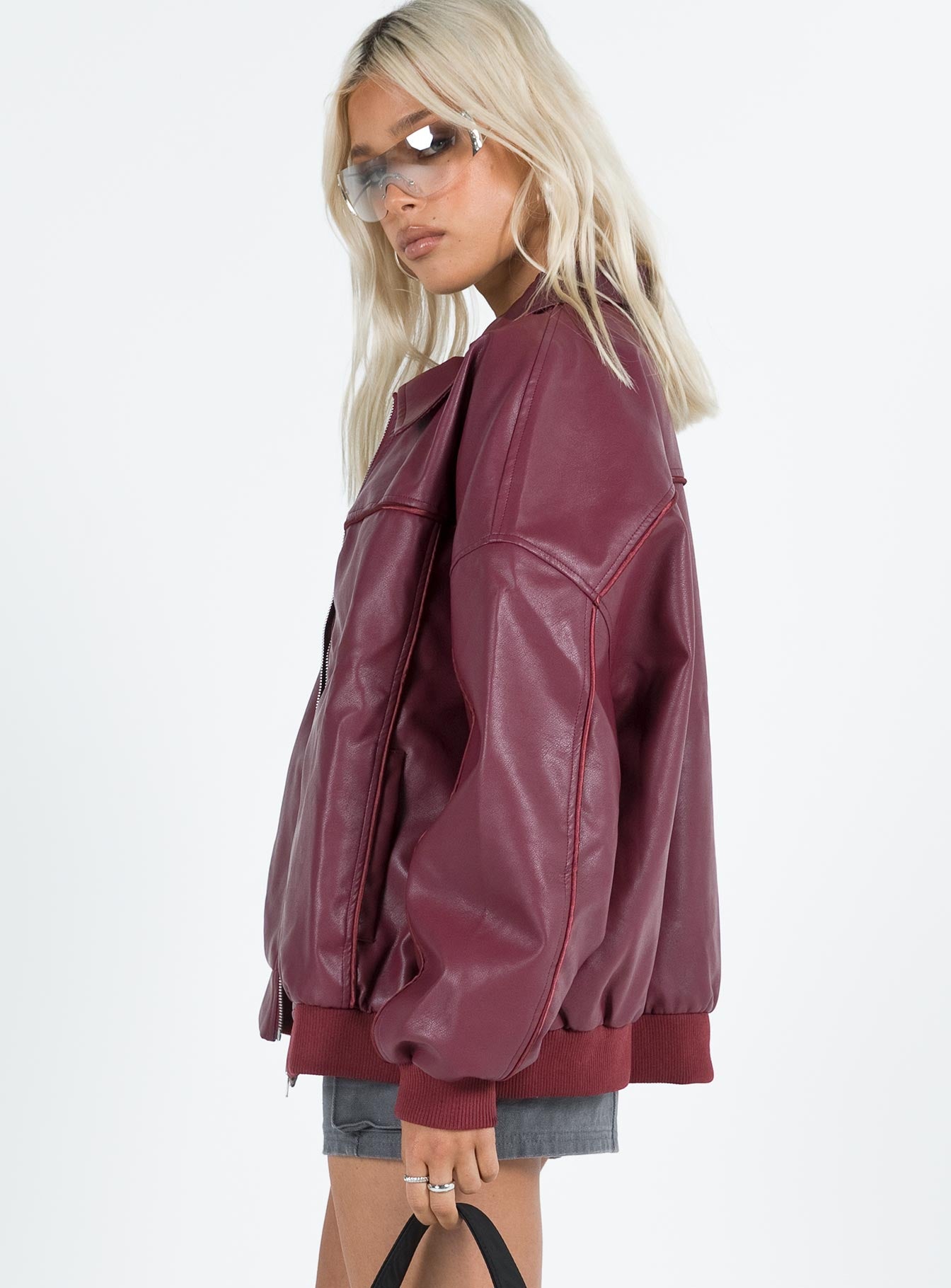Burgundy bomber jacket Faux leather material  Classic collar  Zip front fastening  Ribbed waistband and cuffs  Twin hip pockets