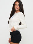 side view of model wearing Princess Polly Martini Bow Long Sleeve Top Cream Full Sleeves Boat Neck 