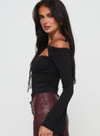 side view of model wearing Princess Polly Nevah Long Sleeve Top Black Full Sleeves straight 