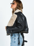 Cropped jacket Faux leather material Oversized collar Removable belts at waist and cuff Buckle fastening 