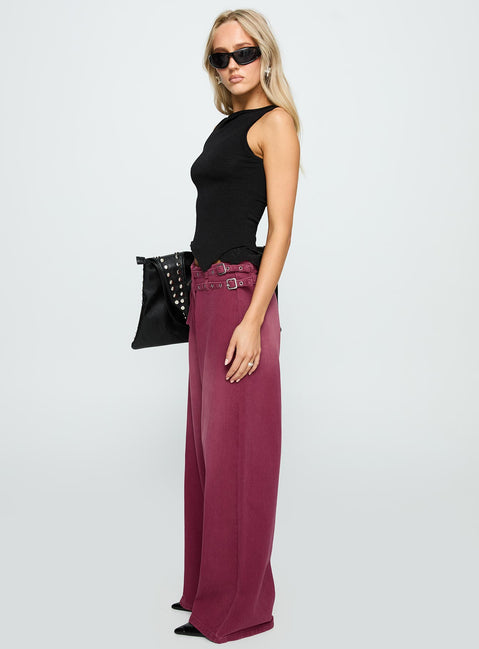 side view of model wearing Princess Polly Paltrow Mid Rise Wide Leg Cargo Jeans Washed Burgundy Mid Rise Jeans 
