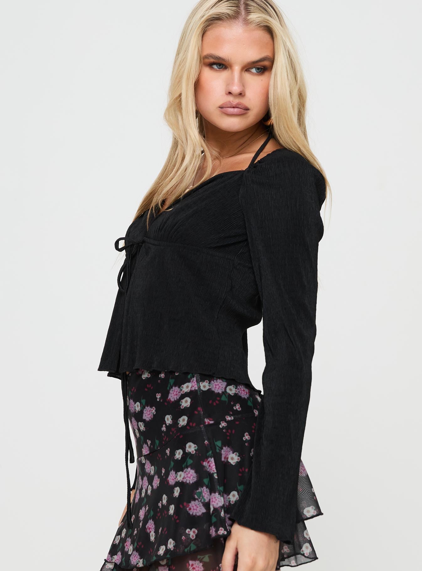 side view of model wearing Princess Polly Chantria Long Sleeve Halter Top Black Full Sleeves Plunger 