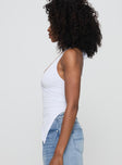 side view of model wearing Princess Polly Chilli Halter Top White Sleeveless Plunger 