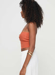 side view of model wearing Princess Polly Kallista Top Orange Sleeveless Sweetheart 