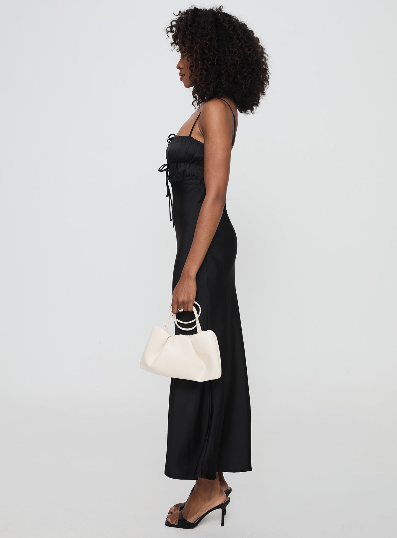 side view of model wearing Princess Polly Jaquelin Maxi Dress Black Square Neck 