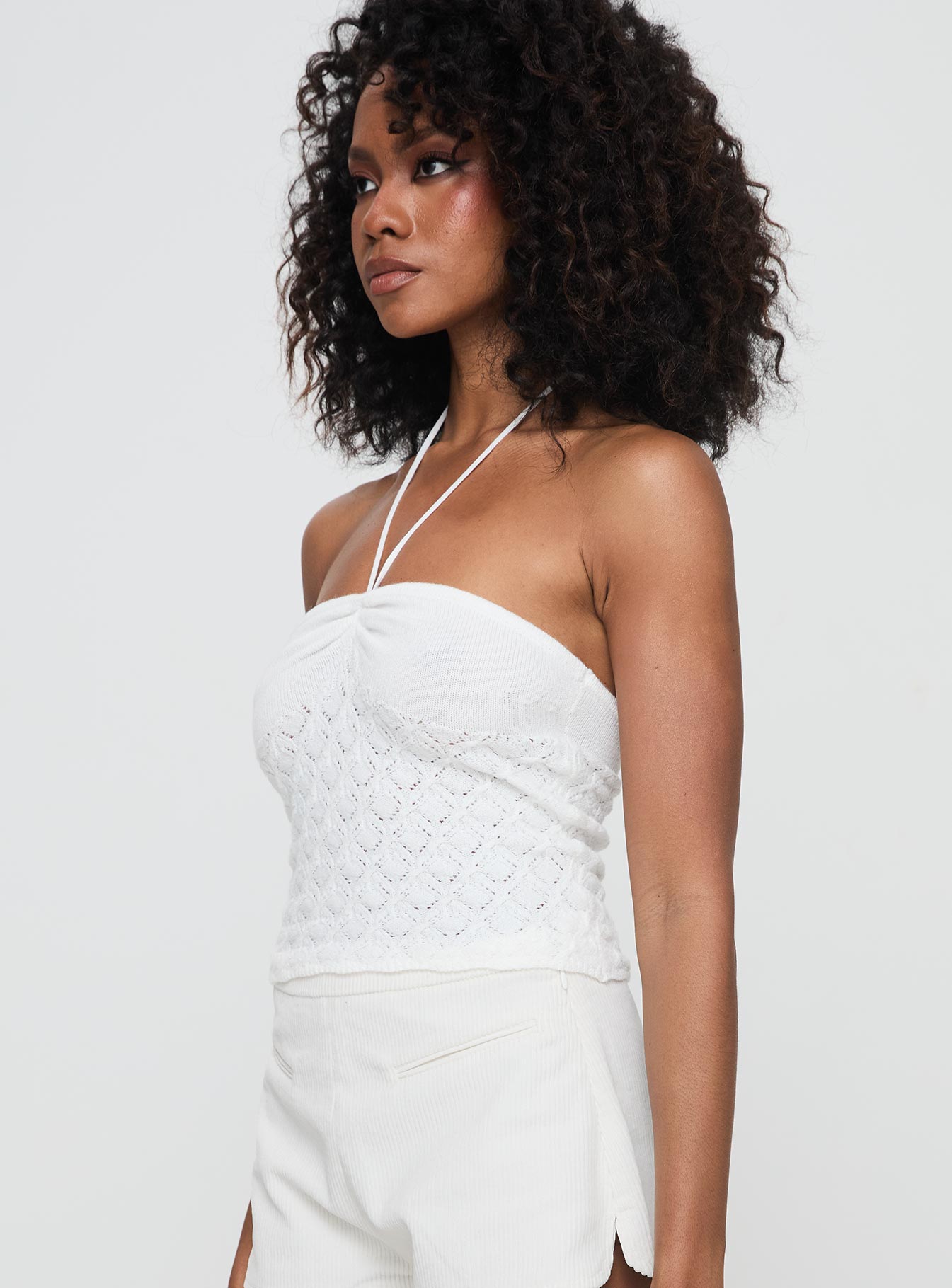 side view of model wearing Princess Polly Kaptan Top White Sleeveless Sweetheart 