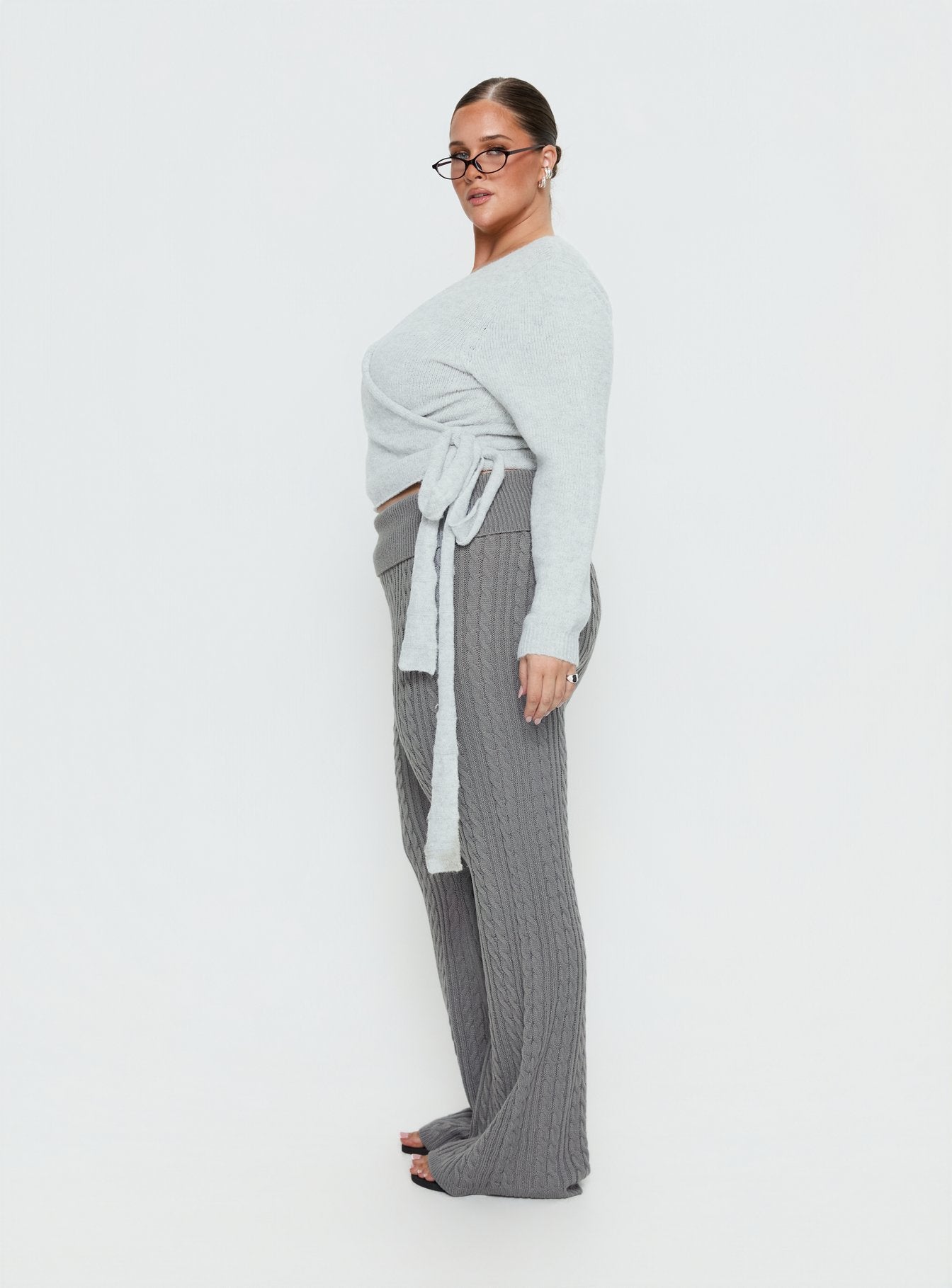 side view of model wearing Princess Polly Baleigh Cable Knit Foldover Pants Grey Curve High Rise Pants 