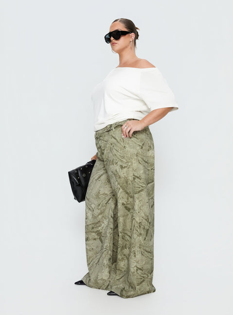 side view of model wearing Princess Polly Mckinley Mid Rise Wide Leg Jeans Camouflage Curve Mid Rise Jeans 
