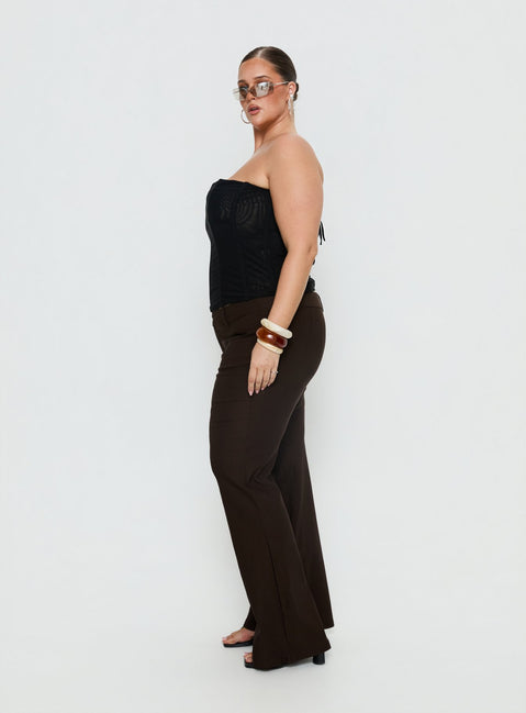 side view of model wearing Princess Polly Kinkirk Flared Pants Chocolate Curve Mid Rise Pants 