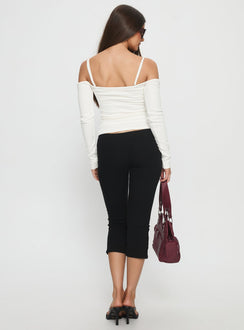 back view of model wearing Princess Polly Baseline Rib Capri Pants Black Tall Mid Rise Pants 