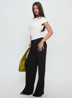 side view of model wearing Princess Polly Gavrielle Jersey Wide Leg Pants Black High Rise Pants 